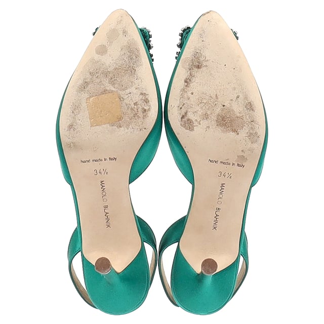 VINTAGE, RRP AS NEW
 Add a touch of luxury and glamour to your footwear collection with the Manolo Blahnik Hangisi 70 Embellished Slingback Pumps in Green Satin. These exquisite pumps are crafted from rich green satin that exudes opulence, while the sleek 70mm heel offers a perfect balance of height and comfort. The standout feature is the intricate embellishment at the toe, adding a dose of sparkle and sophistication to every step you take.

Manolo Blahnik Hangisi 70 Embellished Slingback Pumps in Green Satin

Condition: Very good
Signs of wear: Include Box., Minor markings, Lightly used but very well maintained. Minor mark at soles & creasing, light scuffing at the soles and heels.
Packaging: Box, Dust bag
Color: Green 
Material: Satin 
Size: IT34.5/UK1.5/FR35.5/US4.5/EU34.5
Measurements: Heel height: 80; Insole length: 260
SKU: NAPPUGBSH429005W