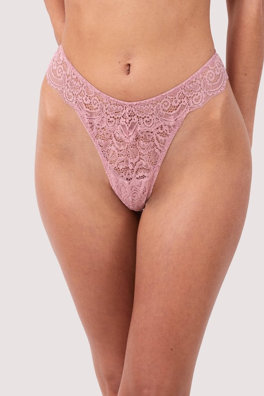 The Ariana range by Playful Promises brings this flirty thong that is perfect for adding a cute feeling to your daily life. Covered in semi-sheer lace it lays softly against your body. It has an extremely flattering shape with a high-cut leg that creates the illusion of longer legs whilst the mid-rise waist and minimal rear coverage showcase your incredible figure.  Flirty thong, Semi-sheer feminine lace, High-cut leg, Mid-rise waist and minimal rear coverage, Elasticated waistband, Comfortable fit, Country of origin: China, Composition: Main: 89% Polyamide | 11% Elastane, Composition: Gusset Liner: 100% Cotton, Listed in UK sizes.   Thong