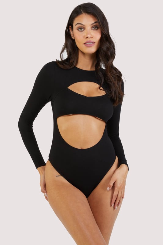 Introducing our Wolf &Whistle Laurel Black CutOut Jersey LongSleeved Body it's the sassy secret weapon your wardrobe's been craving! With its daring cutouts and comfy jersey fabric, this body is ready to unleash your inner mischiefmaker while keeping you looking fab.




Cut out open front detail
Popper fastening gusset
Long sleeves
Full back
Brief style bottom
High rise legs 
Pull on