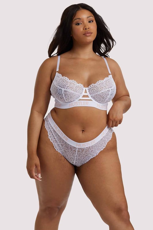 Feel heavenly in our White Hustler branded Lace Brief. Made of flirty floral lace and finished with an elasticated banded waist with Hustler branding to give it a preppy look! Pair it with the matching Lace Bra for the full finish.
 
 Lace Brief
 Elasticated Hustler Banded Waist
 
 Product Info
 Lace: 90% Nylon 10% Elastane Gusset Liner: 100% Cotton Excluding Trims.
 Treat me nice. Do not tumble dry. Hand wash only.