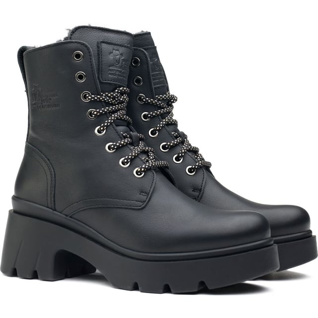 Embrace the seasonal changes in style and confidence with the Panama Jack Porty ankle boots. These black Leather boots blend premium materials with a cleated, rugged rubber sole to provide a gripping, sturdy stride, whilst the block heel and raised sole give extra height. The cosy, cuddly faux fur plush lining keeps your feet warm on chilly days. Their contemporary combat design showcases two-toned laces with gleaming metal eyelets and heel branding. These Panama Jack boots are your quintessential companion for a stand-out, confident look.