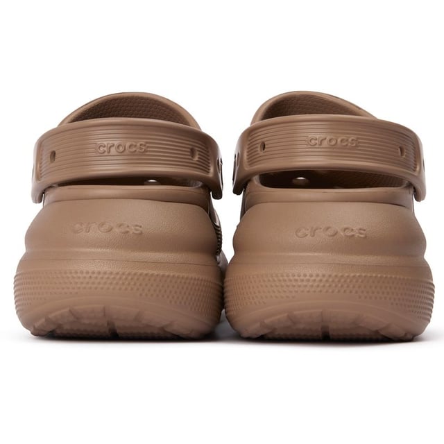 Step into summer fun and give yourself some extra height with the Crocs Classic Crush clogs. These iconic, lightweight slides cradle your feet in blissful comfort thanks to the soft upper and moulded Croslite foam footbed and the platform sole adds a flattering lift to your looks. Slip them on to run errands or enjoy a casual summer day. With signature ventilation ports, these sandals promise carefree fun wherever your days take you.