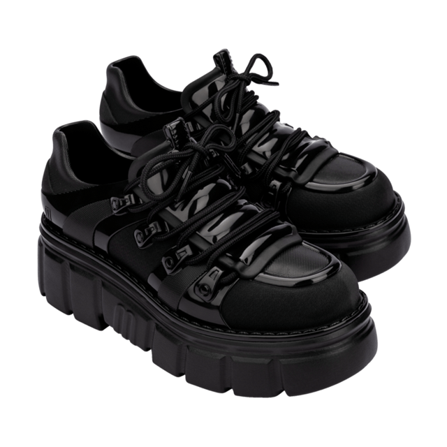 Who knew being a rebel could make one so effortlessly cool? The Melissa Rebel Boot delivers comfort and style with its chunky, treaded sole, laces, and unique design. The combat boot silhouette has been a Melissa bestseller, and this newcomer leaves nothing to be desired