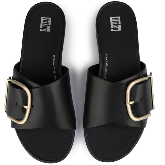 Stap in luxueus comfort met de Fitflop Gracie Maxi Buckle sandalen! Deze chique slippers hebben een strak zwart leren bovenwerk en verfijnde tonale branding. Je zult dol zijn op de naadloze ingebouwde boogcontour en de weelderige leren voering die je voeten zalig ondersteunt. De innovatieve Microwobbleboard-tussenzool zorgt voor schokabsorptie, terwijl de antislip rubberen buitenzool zorgt voor zelfverzekerde stappen. Perfect voor zowel stijl als comfort, de Fitflop Gracie Maxi Buckle is echt een must-have aanvulling op je zomerse garderobe!