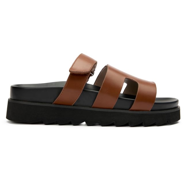 The Shea Slide from V.Gan is the ultimate summer companion.  These fashion-forward, super comfy V.Gans are crafted from high-quality PETA-approved vegan uppers and soles, have a slightly raised platform, offering sleek style and ethical chic. Made in a certified vegan factory using sustainably sourced materials and shipped in recycled packaging, this warm-weather staple will take you on holidays as well as urban alfresco outings and staycation adventures.