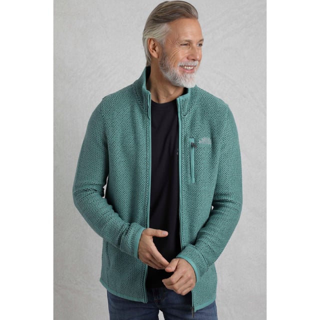 86% Organic Cotton, 14% Recycled Polyester. Fabric: Macaroni. Design: Logo. Hanging Loop. Neckline: High-Neck, Waffle Lined. Sleeve-Type: Long-Sleeved. Pockets: 2 Side Pockets, 1 Chest Pocket, Zip, Waffle Lined. Fastening: Full Zip. Sustainability: Eco Friendly, Made from Recycled Materials. S: 37 in. M: 40 in. L: 43 in. XL: 46 in. XXL: 49 in. 3XL: 52 in. 4XL: 55 in. 5XL: 58 in.