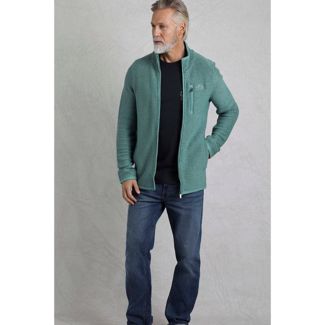 86% Organic Cotton, 14% Recycled Polyester. Fabric: Macaroni. Design: Logo. Hanging Loop. Neckline: High-Neck, Waffle Lined. Sleeve-Type: Long-Sleeved. Pockets: 2 Side Pockets, 1 Chest Pocket, Zip, Waffle Lined. Fastening: Full Zip. Sustainability: Eco Friendly, Made from Recycled Materials. S: 37 in. M: 40 in. L: 43 in. XL: 46 in. XXL: 49 in. 3XL: 52 in. 4XL: 55 in. 5XL: 58 in.