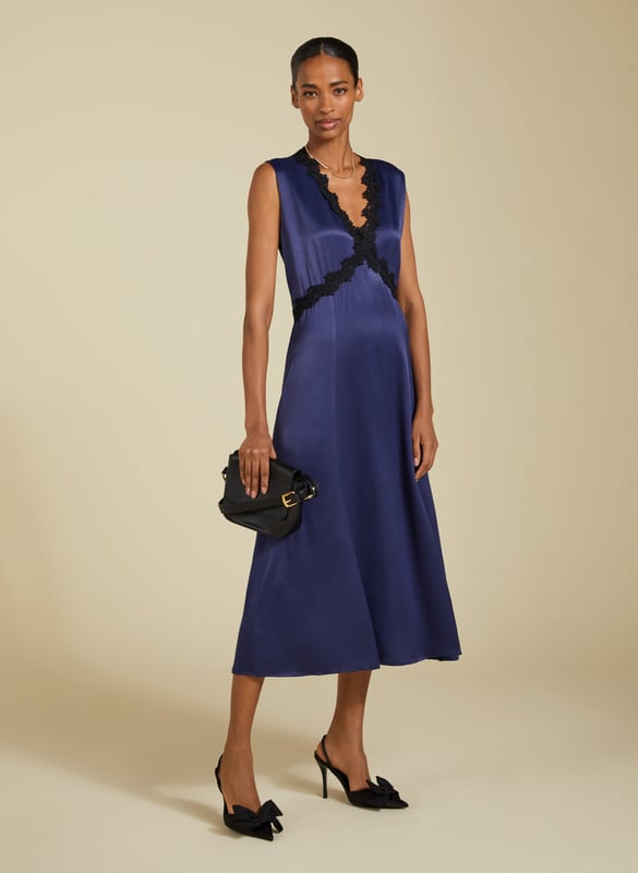 Description\nDate nights are made easy with a chic, lingerie-inspired slip dress. The Marcella Midi Dress is cut with a v-shaped seam under the bust for the most flattering fit, finished with a pretty lace trim. It skims the body before gently flaring out, and we’ve added a discreet panel of elastication to the back waist for maximum comfort. Cut from responsibly-sourced Ecojilin satin, it’s one to swish the night away in!\n\nMade in Europe\nCrafted in Ecojilin blend\nFastens with a concealed side zip\nMidi length\n\n\nSustainable Attributes:\n  Low Water Use   Recycled Fibres   Ethically made\nDetails\nModel is 5'10 (177cm) and is wearing a UK 1055% Ecojilin, 45% Commercial JilinDry Clean OnlyWash Inside Out - Wash Dark Colours SeparatelyProduct Code: DR40587-DPIBack shoulder at neck to hem - 122cm (48)