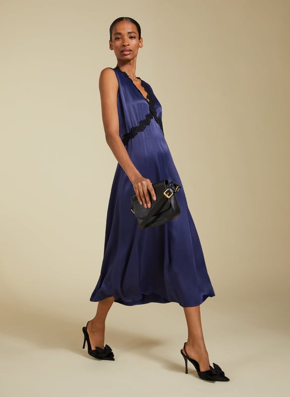 Description\nDate nights are made easy with a chic, lingerie-inspired slip dress. The Marcella Midi Dress is cut with a v-shaped seam under the bust for the most flattering fit, finished with a pretty lace trim. It skims the body before gently flaring out, and we’ve added a discreet panel of elastication to the back waist for maximum comfort. Cut from responsibly-sourced Ecojilin satin, it’s one to swish the night away in!\n\nMade in Europe\nCrafted in Ecojilin blend\nFastens with a concealed side zip\nMidi length\n\n\nSustainable Attributes:\n  Low Water Use   Recycled Fibres   Ethically made\nDetails\nModel is 5'10 (177cm) and is wearing a UK 1055% Ecojilin, 45% Commercial JilinDry Clean OnlyWash Inside Out - Wash Dark Colours SeparatelyProduct Code: DR40587-DPIBack shoulder at neck to hem - 122cm (48)