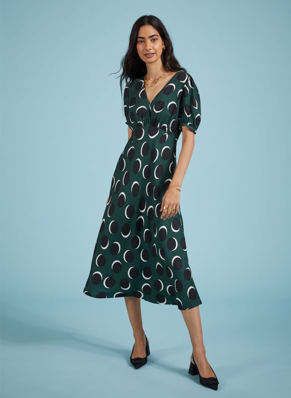 Description\nFits true to size, we suggest ordering your usual size.\nA customer favourite, the Kaydence dress returns for a new season in a fresh print. This chic midi is the one for smart events: it’s woven from Livaeco viscose, which gives a soft touch and lovely drape. Cut into an A-line shape, it features an under-the-bust seam and is slim through the waist. Wear it to every outing in your calendar with a blazer and your favourite shoes.\n\nMade in Europe\nWoven viscose twill with Livaeco\nFastens with an invisible centre-back zip\nMidi length\nV-shape neckline\n\n\nSustainable Attributes:\n Low Water Use Ethically made  Low Carbon \n\nDetails\n100% LivaecoDelicate Machine Wash - 30°Product code: DR40616-GSS Back shoulder at neck to hem - 124cm (48 3/4)Sleeve length - 29cm (11 1/2)