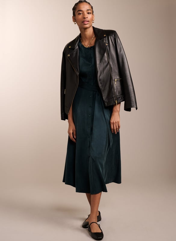 Description \n\nWhether it’s for brunch or work, you’ll feel ready for anything in Malin. This midi in recycled Cupro feels silky against the skin, and boasts a soft sheen in gorgeous green. It buttons all the way through and skims the waist to flatter. Tie with the self belt or a contrasting leather. It goes effortlessly with knee-high boots, loafers or mary-janes.  \n\n \nMade in Europe\n\nCrafted in recycled Cupro   \n\nPockets in side seams  \n\nCo-ordinating self-tie belt  \n\nElbow-length sleeves  \n\nSingle button cuffs  \n\n \n\n \n\nSustainable Attributes: \n\n Low Water Use   Recycled Fibres  Ethically made  \n\n \n\nDetails \n\n Model is 5'10 (177cm) and is wearing a UK 1053% Recycled Cupro, 47% Ecovero ViscoseDelicate Machine Wash 30˚Product code: DR40572-DAG Back shoulder at neck to hem - 119cm (46 7/8)Sleeve length - 48cm (18 7/8)