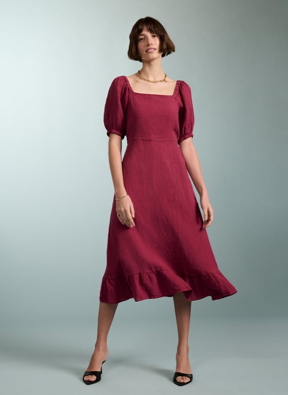 Description\nJuicy like a ripe raspberry and just the right side of crinkly, Nancy is the ultimate summer dress. This style in natural linen comes in a flattering, fit-and-flare silhouette, and a statement square neckline. Its sleeves are pretty and puffy, with elasticated details around the shoulder and cuffs. A style to breeze around in on a hot day, or on holiday, its criss-cross back makes it simply irresistible.\n\nMade in Europe\nCrafted in pure flax linen\nFastens with a concealed center back zip\nCan be worn with a strapless bra\nLong midi length\n\n\nSustainable Attributes:\n  Low Water Use   Natural fibres   Ethically made    Vegan \n\nDetails\n100% LinenDelicate Machine Wash - 30°Product code: DR40475-RASBack shoulder at neck to hem - 120cm (47 1/4)Sleeve length - 35cm (13 3/4)