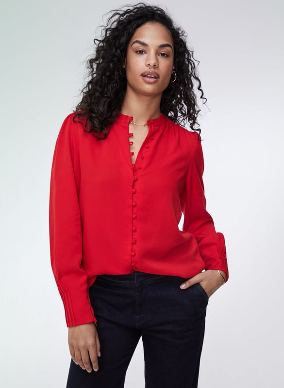 Description\nFits true to size, we suggest ordering your normal size.\nWhat our customers say: This is a beautiful blouse, and the material is really soft.\nWhether it’s for work or dinner, the Annika will instantly add a touch of feminine elegance to your looks. It comes with pretty, rouleau loop button fastenings, gathered shoulders and deep cuffs with pleated details on the outer section for that extra detail. It comes in a relaxed fit so it can easily be tucked in. This is a stunning blouse you will enjoy for years.\nChic and stunning - Baukjen\n\nMade from eco-friendly TENCEL™\nButton-through\nRelaxed fit\n\n\nSustainable Attributes:\n Made in Europe  Low Water Use Ethically made   Vegan  \n\nDetails\n100% LENZING TENCEL™ Delicate Machine Wash - 30°Product Code: SH40164-CRDBack shoulder at neck to hem - 65cm (25 5/8) Sleeve length - 64cm (25 1/4)