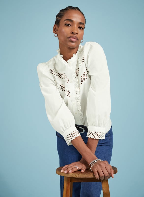 Description\nFits true to size, we suggest ordering your usual size.\nIf your weak spot is a romantic, white cotton blouse then prepare to be seduced by Isamaya! This style is loaded with panels of intricate broderie anglaise along the chest, and which also adorns the collar and front opening as a pretty ruffle. Even the cuffs are a moment, with more embroidery detail. Just add jeans for a feelgood, feminine outfit.\n\nMade in Europe\nCrafted in organic cotton voile\nButton cuffs\nGathering into sleeves and shoulders\n\n\nSustainable Attributes:\n  Natural fibres   Organic   Ethically made \nDetails\nModel is 5'10 (177cm) and is wearing a UK 10100% Organic Cotton Delicate Machine Wash - 30°Product code: SH40272-SFWBack shoulder at neck to hem - 61cm (24)Sleeve length - 56.5cm (22 1/4)