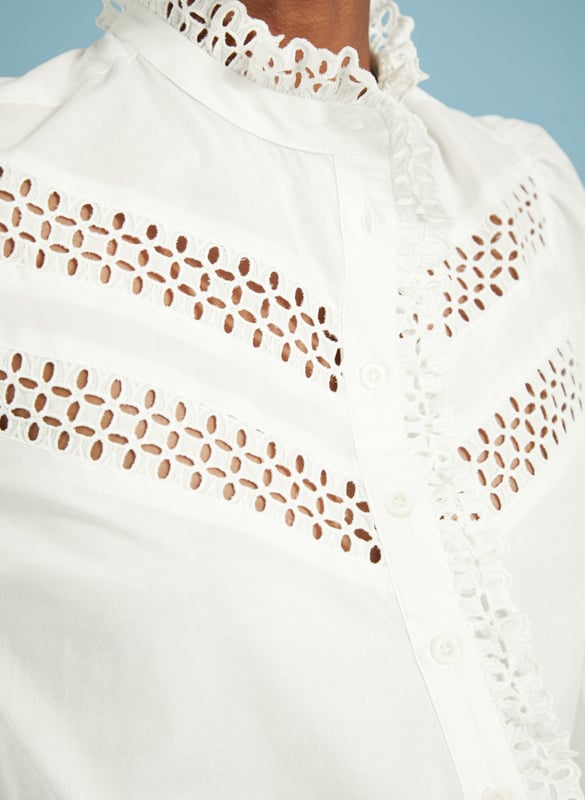 Description\nFits true to size, we suggest ordering your usual size.\nIf your weak spot is a romantic, white cotton blouse then prepare to be seduced by Isamaya! This style is loaded with panels of intricate broderie anglaise along the chest, and which also adorns the collar and front opening as a pretty ruffle. Even the cuffs are a moment, with more embroidery detail. Just add jeans for a feelgood, feminine outfit.\n\nMade in Europe\nCrafted in organic cotton voile\nButton cuffs\nGathering into sleeves and shoulders\n\n\nSustainable Attributes:\n  Natural fibres   Organic   Ethically made \nDetails\nModel is 5'10 (177cm) and is wearing a UK 10100% Organic Cotton Delicate Machine Wash - 30°Product code: SH40272-SFWBack shoulder at neck to hem - 61cm (24)Sleeve length - 56.5cm (22 1/4)