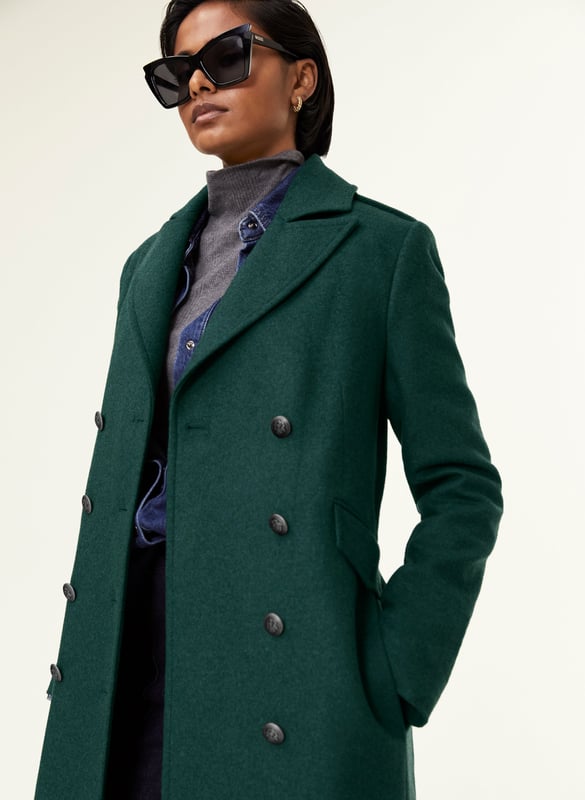 Description\nA beautifully-cut coat will elevate any outfit. Inge is one of our most sophisticated styles, with military-inspired epaulettes and naval-style buttons. Devastatingly elegant, it is made from a recycled wool blend and cut for a longer length to keep you wrapped up in style. Enjoy year after year!\nOur recycled wool blends may have small imperfections as a result of the recycling process, this means every piece is a little bit unique.\n\nCrafted in a recycled wool blend\nFully lined\nFlap pockets accessed from the sides\nLong length\nTailored fit\n\n\nSustainable Attributes:\n Made in Europe  Low impact  Low Water Use  Mulesing free    Recycled Fibres  Ethically made   Low Carbon \n\nDetails\nModel is 5'10 (177cm) and is wearing a UK 1055% Recycled Wool, 30% Recycled Polyester, 10% Recycled Acrylic, 5% OFDry Clean OnlyProduct code: OT40079-PNG Back shoulder at neck to hem - 120cm (47 1/4) Sleeve length - 61cm (24)