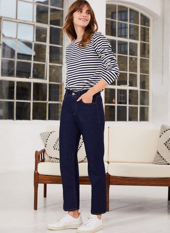 Description\nIf you are looking for a change from skinnies but want to keep to a jean that will work in more formal environments too, this sturdy, non-stretch style with a pleated front, ticks every box.” - Katherine Ormerod\nThe search for simple, straight-leg ankle-grazing jeans ends with Adelaide. The dark indigo wash lends a smart, elegant feel and the fit is equally as considered: fitted through the waist and hips they are topped with a crease down the front of the legs. Note that this style is non-stretchy, and omitting elastane is much kinder to the planet.\n\nCrafted from premium organic cotton\nStraight leg shape\n\nRigid denim texture\n\nSmart staple\n\n\nSustainable Attributes:\n Made in Europe   Natural fibres    Organic Ethically made   Vegan \n\nDetails\n100% Organic CottonMachine Wash - 40°Product code: TR40224-DINInside leg - 67cm (26 3/8)