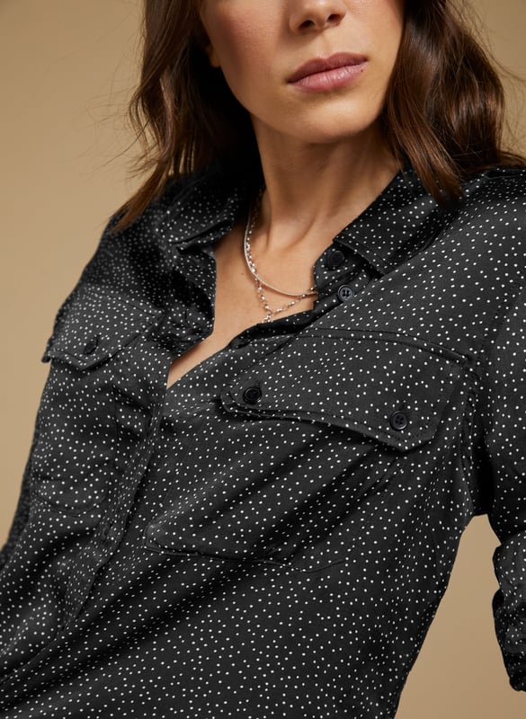 Description\nFits true to size, we suggest ordering your usual size.\nWoven from a premium responsibly sourced viscose that feels like silk, Saffron is a chic sateen shirt to update your wardrobe. Its utility pockets detailing, and subtle spot print make it a contemporary classic. Easy and effortless, style it with the co-ordinating Mandy Satin Trousers for a cool co-ordinating look.\n\nMade in Europe\nCrafted in viscose satin Lenzing™ EcoVero™\nUtility pocket detailing\nButton through\nRelaxed fit\n\n\nSustainable Attributes:\n  Low impact  Low Water Use   Natural fibres   Recycled Fibres   Ethically made  Low Carbon \n\nDetails\nModel is 5'10 (177cm) and is wearing a UK 1049% Lenzing™ EcoVero™ Viscose, 51% Recycled ViscoseDelicate Machine Wash 30˚Product Code: SH40284-BNSBack shoulder at neck to hem - 65cm (25 5/8)Sleeve length - 60cm (23 5/8)
