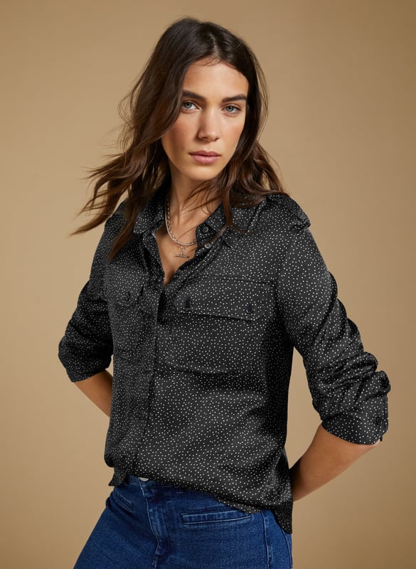 Description\nFits true to size, we suggest ordering your usual size.\nWoven from a premium responsibly sourced viscose that feels like silk, Saffron is a chic sateen shirt to update your wardrobe. Its utility pockets detailing, and subtle spot print make it a contemporary classic. Easy and effortless, style it with the co-ordinating Mandy Satin Trousers for a cool co-ordinating look.\n\nMade in Europe\nCrafted in viscose satin Lenzing™ EcoVero™\nUtility pocket detailing\nButton through\nRelaxed fit\n\n\nSustainable Attributes:\n  Low impact  Low Water Use   Natural fibres   Recycled Fibres   Ethically made  Low Carbon \n\nDetails\nModel is 5'10 (177cm) and is wearing a UK 1049% Lenzing™ EcoVero™ Viscose, 51% Recycled ViscoseDelicate Machine Wash 30˚Product Code: SH40284-BNSBack shoulder at neck to hem - 65cm (25 5/8)Sleeve length - 60cm (23 5/8)