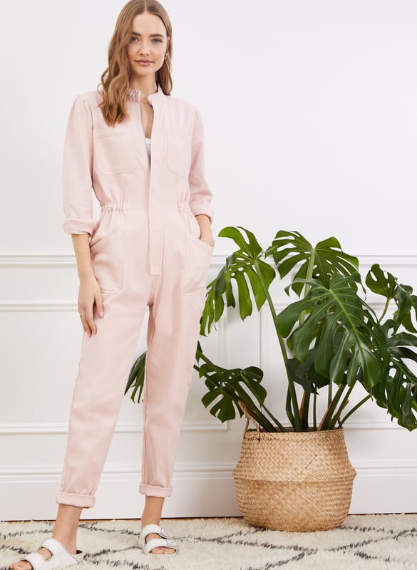 Description\nSally is quite literally a one-piece wonder! A feminine take on a boiler suit, we’ve added a ruffled stand collar and gathering into the shoulders, and for a flattering fit, a tapered leg shape and an elasticated waist. There are so many ways to style it: worn open with a tank and hi-tops, or fully fastened with big hoops and heels. Either way, expect to wear it on repeat.\nI love this. Easy one-piece style Baukjen\n\nCrafted in premium organic cotton\nZip fastening - simply pulls on\nPatch pockets on the chest and hips\nCan be styled with a belt\n\n\nSustainable Attributes:\n Made in Europe Ethically made  Vegan   Natural fibres   Organic \n\nDetails\n97% Organic Cotton, 3% ElastaneMachine Wash - 30°Product code: JS40045-PPKInside leg - 73cm (28 3/4)Sleeve length - 60.5cm (23 7/8)