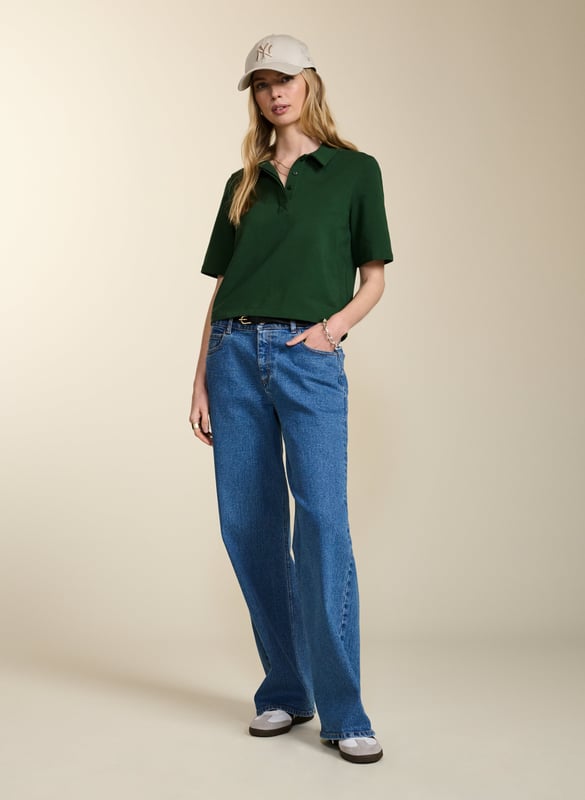 Description\nFits true to size, we suggest ordering your usual size.\nWe love the ease and versatility of a classic polo top. Margaret’s shape is slightly cropped with a relaxed fit and concealed buttons for a contemporary twist on a loyal piece. But best of all, this style is as low-impact as possible thanks to regenerative cotton, which is the most environmentally-conscious way of farming for fabrics. A proud new addition to Baukjen Lab. \n\nMade in Europe\nCrafted in regenerative cotton  \nRelaxed, cropped shape \nPulls on\n\n\nSustainable Attributes:\n\n\n Low Impact \n \n Low Water Use \n \n Natural fibres \n \n Ethically made \n\n Vegan \n \n Low Carbon \n\nDetails\n Model is 5'10 (177cm) and is wearing a UK 10\n96% Regen Cotton, 4% Elastane\nDelicate Machine Wash - 30°\nProduct code: TP40767-AQW \nBack shoulder at neck to hem - 53cm (20 7/8)\nSleeve length - 26.5cm (10 3/8)