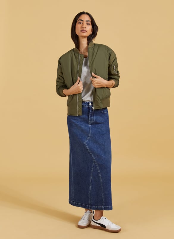 Description\nThe Nia skirt is nostalgic dressing at its finest! This style in organic cotton denim is quite literally a jeans skirt, with the waistband and fastenings borrowed from a classic pair of jeans. It’s cut to hug the waist and hips before gently flaring out into an a-line shape. A casual saviour, we’ll be wearing it with tees, boyfriend shirts and bomber jackets.\n\nMade in Europe\nCrafted in organic cotton denim\nStretchy\nAnkle length\nZip fly and button fastening\n\n\nSustainable Attributes:\n\n  \n Low Impact \n\n Low Water Use \n    Natural fibres \n    Ethically made \n    Organic \n\nDetails\nModel is 5'10 (177cm) and is wearing a UK 1099% Organic Cotton, 1% ElastaneProduct code: SK40178-DINCentre back waist to hem - 92cm (36 ⁷/₃₂)