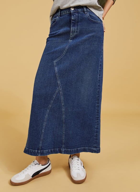Description\nThe Nia skirt is nostalgic dressing at its finest! This style in organic cotton denim is quite literally a jeans skirt, with the waistband and fastenings borrowed from a classic pair of jeans. It’s cut to hug the waist and hips before gently flaring out into an a-line shape. A casual saviour, we’ll be wearing it with tees, boyfriend shirts and bomber jackets.\n\nMade in Europe\nCrafted in organic cotton denim\nStretchy\nAnkle length\nZip fly and button fastening\n\n\nSustainable Attributes:\n\n  \n Low Impact \n\n Low Water Use \n    Natural fibres \n    Ethically made \n    Organic \n\nDetails\nModel is 5'10 (177cm) and is wearing a UK 1099% Organic Cotton, 1% ElastaneProduct code: SK40178-DINCentre back waist to hem - 92cm (36 ⁷/₃₂)