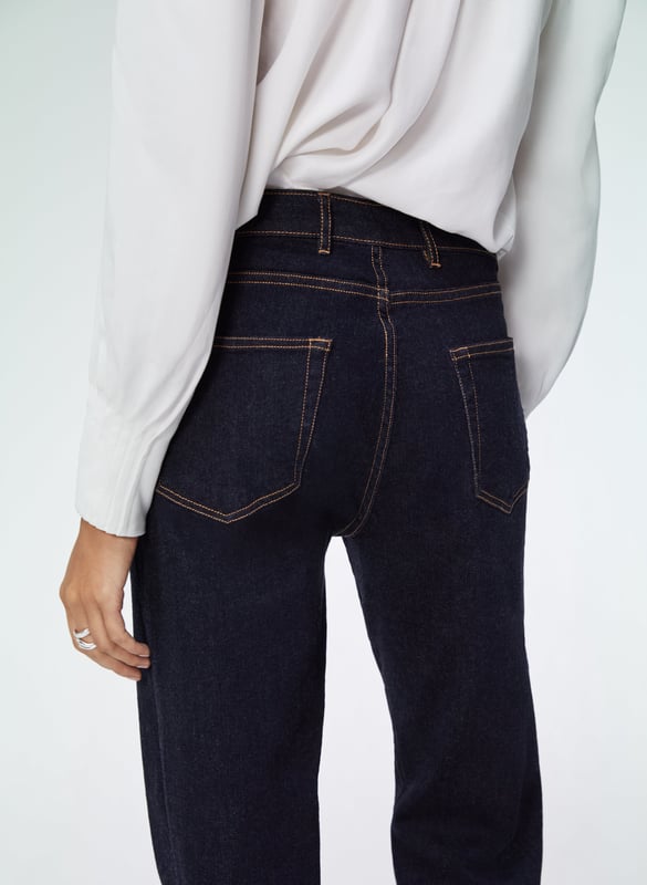 Description\nFits true to size, we suggest ordering your usual size.\nWe’ve tweaked our much-loved organic cotton Boyfriend Jean to incorporate recycled elastane. A small amount is needed for a comfy stretch - but it's a synthetic fibre - so after years of searching, we’re thrilled to have found a lower impact alternative. Expect the same cropped and subtly tapered leg shape with a flattering and feminine fit which has made this style one of our best-sellers. \n“This style formula never dates” - Baukjen\n\nMade in Europe\nCrafted in premium organic denim that holds its shape\nSubtly tapered leg\nEasy fit around the hip and thigh\nAdded stretch for comfort\n\n\nSustainable Attributes:\n Natural fibres  Organic  Ethically made\n Low Carbon    Vegan\n\nDetails\n99% Organic Cotton, 1% ElastaneMachine Wash - 30°Wash Inside Out - Wash Dark Colours SeparatelyProduct Code: TR512-DARInside leg (Rolled) - 68cm (26 3/4”) (Unrolled) - 72cm (28 3/8”)