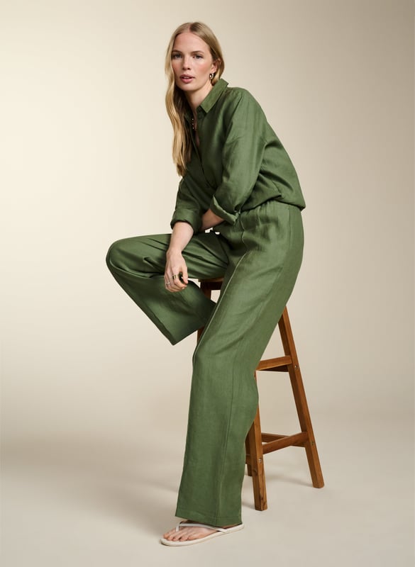 Description\nFits true to size, we suggest ordering your usual size.\nConsider Yvonne as a ‘semi-smart’ trouser - they blend the elegance of wide-leg tailoring with the comfort of an elasticated waistband (really!). This style in lightweight hemp features a pintuck down each leg and a simple, fuss-free front. We’ll be styling them with the matching Della Hemp Shirt for a low-maintenance co-ord.  \n\nMade in Europe \nCrafted in hemp \nPockets in side seams \nSimply pull on  \n\n\nSustainable Attributes:\n\n \n Low Water Use \n \n Natural fibres  \n \n Ethically made  \n \n Vegan  \n \n Low Carbon \n\n\nDetails\n Model is 5'10 (177cm) and is wearing a UK 10100% Hemp \nDelicate Machine Wash - 30°\nProduct code: TR40350-LKH \nInside leg - 80cm (31 1/2)