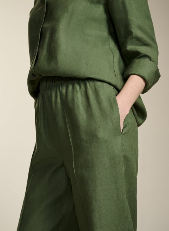 Description\nFits true to size, we suggest ordering your usual size.\nConsider Yvonne as a ‘semi-smart’ trouser - they blend the elegance of wide-leg tailoring with the comfort of an elasticated waistband (really!). This style in lightweight hemp features a pintuck down each leg and a simple, fuss-free front. We’ll be styling them with the matching Della Hemp Shirt for a low-maintenance co-ord.  \n\nMade in Europe \nCrafted in hemp \nPockets in side seams \nSimply pull on  \n\n\nSustainable Attributes:\n\n \n Low Water Use \n \n Natural fibres  \n \n Ethically made  \n \n Vegan  \n \n Low Carbon \n\n\nDetails\n Model is 5'10 (177cm) and is wearing a UK 10100% Hemp \nDelicate Machine Wash - 30°\nProduct code: TR40350-LKH \nInside leg - 80cm (31 1/2)