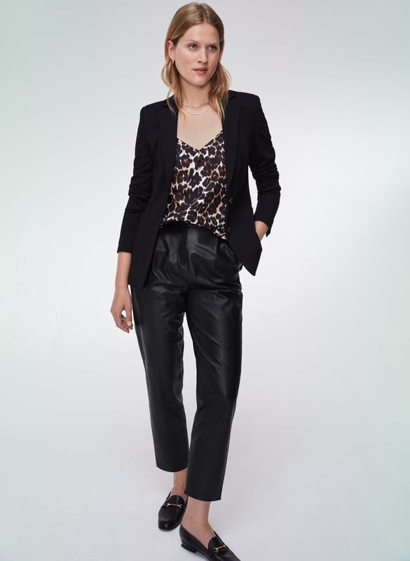 Description\nFits true to size, we suggest ordering your normal size.\nWelcome the versatility of a printed camisole into your wardrobe. The Sutton is crafted from soft and cool TENCEL™, and comes in a timeless leopard print for an injection of glamour, while the double-strap detail sets it apart from the rest. Dress it down with summer staples, and into the office or for evenings out under a tailored blazer - its versatility will surprise you!\n\nCrafted in TENCEL™\nSimply pulls on\nRelaxed fit\n\n\nSustainable Attributes:\n Made in Europe  Low Water Use Ethically made   Vegan  \n\nDetails\nModel is 5'10 (177cm) and is wearing a UK 10100% LENZING™ TENCEL™ Delicate Machine Wash - 30°Product code: TP40708-BNL Back shoulder at neck to hem - 55cm (21 5/8)