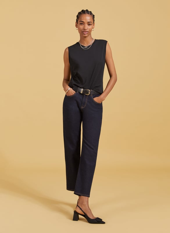 Description\nSlim fit. For a looser look, we suggest sizing up from your usual size.\nAmber isn’t a vest top nor a classic tee - she’s perfectly in-between. Cut for a neat fit and designed to just meet the top of your jeans and chinos, it’s a casual basic you’ll wonder how you got by without. In organic stretch cotton, it’s comfortable too. Prepare to wear on repeat.\n\nMade in Europe\nCrafted in organic stretch cotton\nFitted\nShaped armholes\n\n\nSustainable Attributes:\n\n    Low Impact \n  \n Low Water Use \n    Natural fibres \n   Ethically made\n    Low Carbon \n  Organic \n\nDetails\n95% Organic Cotton, 5% Elastane Delicate Machine Wash - 30°Product Code: TP40715-BLKBack shoulder at neck to hem - 53cm (20 7/8)