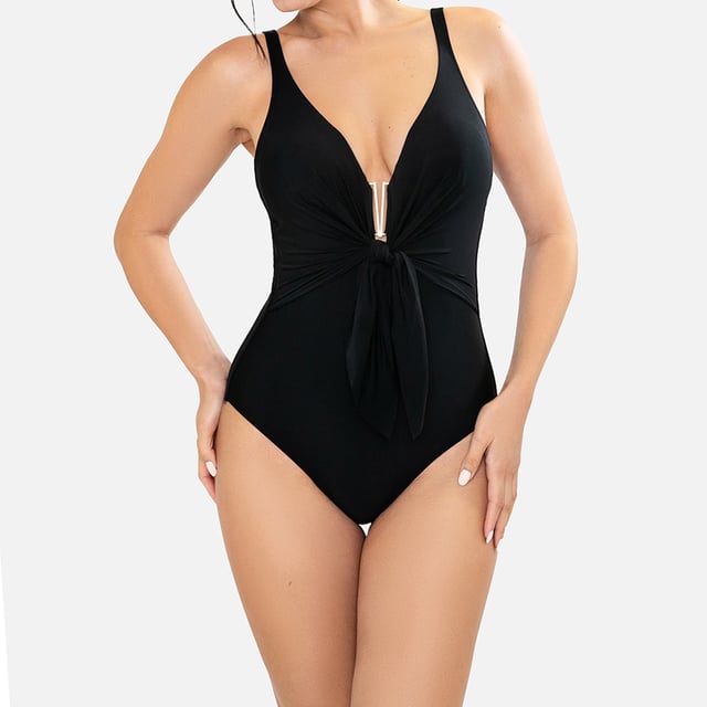 This one-piece swimsuit for women combines elegance and comfort with a slimming design that flatters the silhouette. Its high-quality materials and carefully crafted details make it an ideal women's swimsuit for looking sophisticated on the beach or pool.\n\n Details:\n - Central gathering with decorative bow.\n - Adjustable straps.\n - Foam cups.\n - V-neckline and low back.\n - Abdominal control.\n - Quick-drying and chlorine-resistant material.\n - Optimal coverage and support.\n\n We can safely say that women's one-piece swimsuits will offer you everything you are looking for. If you are interested in purchasing a stylish and practical piece that will allow you to swim at any time of the year, then women's one-piece swimsuits are for you!\n\n Our one-piece swimsuits for women adapt perfectly to any type and size of breast without exception.\n Composition: Outer: 84% Polyamide, 16% Elastane; Inner 1: 92% Polyester, 8% Elastane; Inner 2: 90% Polyester, 10% Elastane; Cup: 100% Polyester\n Care:\nHand wash.\n Use neutral soap.\n Do not twist or squeeze.\n Air dry.