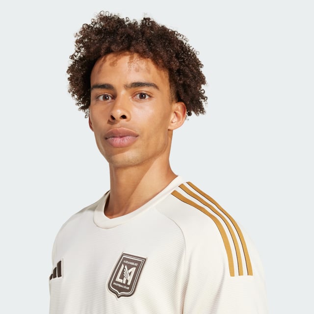 Football fever first took hold in LA in the mid 1970s. Celebrating those boom years, this adidas Los Angeles FC authentic jersey throws out vintage vibes with an era-appropriate colour palette and a bold team name on the chest. Ventilating HEAT.RDY and lightweight details make for unbeatable performances on the pitch. This product is made with 100% recycled materials. By reusing materials that have already been created, adidas help to reduce waste and our reliance on finite resources and reduce the footprint of the products adidas make.  - Slim fit - Crewneck - 100% polyester (recycled) - HEAT.RDY - Mesh side panels - Los Angeles FC raised embroidery crest - Ribbed cuffs - Droptail hem  Shipped by adidas