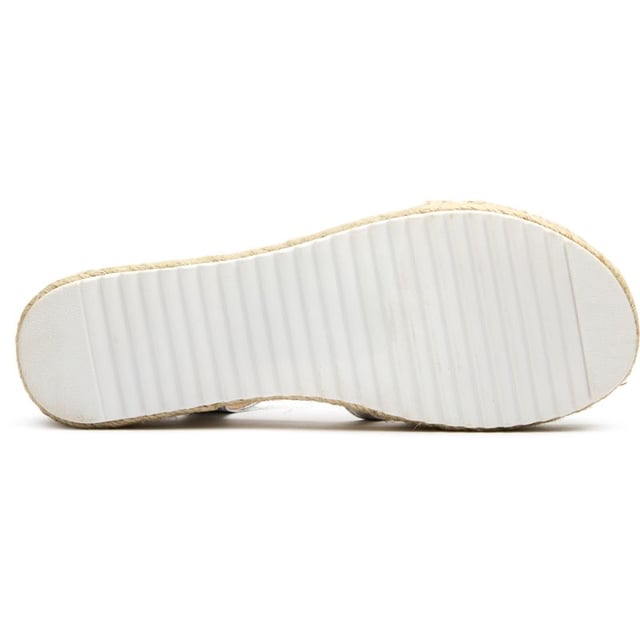 The Solesister Trixie espadrilles blend beach-ready style with urban flair. These women's metallic sandals stand out with their eye-catching flatform design and shimmering details that catch the light beautifully. Crafted with a comfortable synthetic upper and reliable rubber sole, they provide both style and practicality. The Trixie fits true to size, ensuring a perfect fit right out of the box. Ideal for elevating casual outfits or complementing your vacation wardrobe.