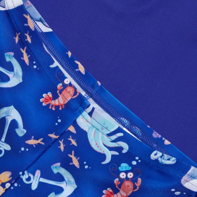 Bring the magic of the ocean to life with our Water Explorers range. Featuring bold colours and a nautical\u0002themed sailboat print  this Short Sleeve Rash Top Set appeals to your little one’s sense of fun and includesa matching top and shorts. The pull-on rash top provides coverage for their shoulders  tummy and backand includes UV protective fabric of UPF40+ for sun protection in and out of the water. Designed for alltheir water adventures  our EnduraBrite fabric offers higher chlorine resistance than standard swimwearfabrics  delivers superb colour performance and fits like new for longer with CREORA® HighClo™. Made inpart from recycled plastic bottles - polyester yarns in the Endurabrite fabric are made from 100% pos