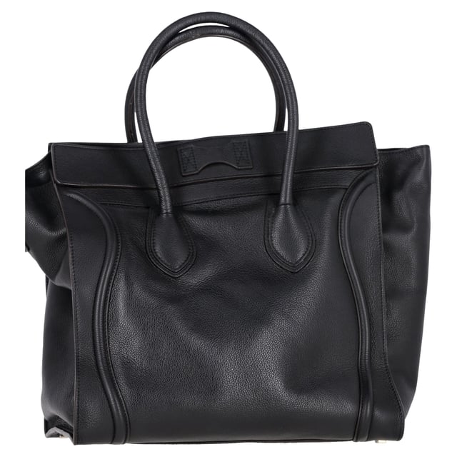 VINTAGE, RRP AS NEW
The Celine Mini Grained Luggage Tote in black leather is a sophisticated statement piece. Crafted from smooth calfskin leather, this bag features iconic rolled leather top handles adorned with signature Celine scroll trim, offering both style and practicality for everyday use or travel.
with Dust bag
Celine Mini Grained Luggage Tote in Black Leather
Condition: very good
Signs of wear: No retail tag, No visible sign of wear., 
Packaging: Dust bag
Color: black
Material: Leather | leather
Size: One Size | One Size
SKU: 458814 / NAPPUGBBA431535W  
Dimensions:  Length: 220 mm, Width: 50 mm, Height: 150 mm