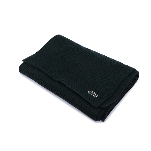 Lacoste Ribbed Rectangular Wool Scarf. Thanks to its classic design and its comforting warmth, this scarf will be your best ally to face the winter cold.- Wool Rib 2*2.- 3cm green crocodile. Material: 100% Wool. Ref: RE2217YZP.