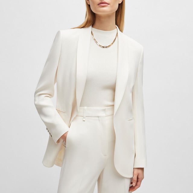 Women's Boss Jirea Regular-Fit Blazer. A fully lined jacket by BOSS Womenswear, tailored to a regular fit in matte fabric with an edge-to-edge front. For our BETTER BOSS products, we always use at least 60% better raw materials. This product is made with cellulose fibres, derived from natural raw wood material and sourced from responsibly managed forests. We cooperate with external organisations to ensure respectful treatment of virgin and endangered forests. Ref: 50512808118.