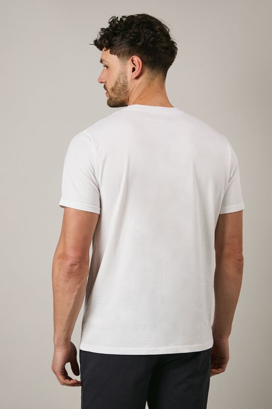 Soft jersey cotton t-shirt featuring the distinctive Maine rope graphic print
        Classic crew neckline with ribbed trim for a comfortable fit
        Short sleeves with clean-finished edges for everyday comfort
        Relaxed yet structured silhouette that maintains its shape throughout the day
        Versatile design that pairs effortlessly with both casual and smart-casual attire
    
    This Maine graphic t-shirt combines simplicity with subtle nautical flair, making it a wardrobe essential for the modern gent. The distinctive rope design adds character without overwhelming, perfect for those who appreciate understated style. Pair with dark chino shorts and trainers as shown for a refined summer look, or layer under an unstructured blazer with tailored trousers for smart-casual occasions. The breathable cotton fabric ensures all-day comfort whether you're meeting friends for a weekend brunch or enjoying a casual evening at the local pub. This t-shirt transitions seamlessly from daytime errands to relaxed evening gatherings, embodying that effortless British casual style that never feels overdone.