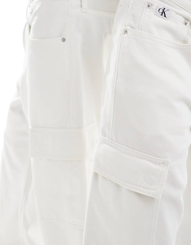 Calvin Klein Jeans co-ord 90s loose cargo jeans in white wash - ASOS Exclusive Jeans by Calvin Klein Jeans Jacket sold separately Relaxed fit Belt loops Functional pockets Branded patch to reverse Unisex styleSold By: Asos