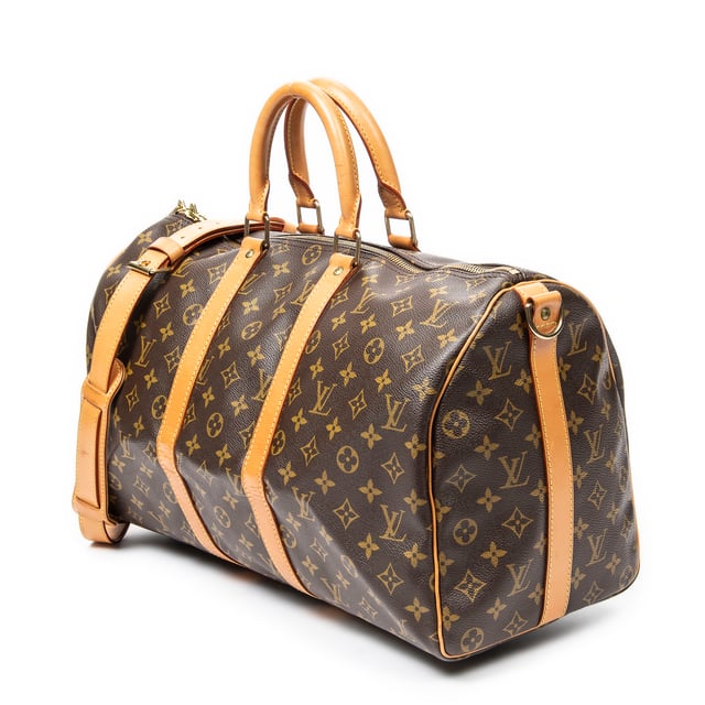 Louis Vuitton Bags Keepall Bandouliere 45 Travel Bag in Brown Monogram Canvas and Golden Brass hardware. The product is in Excellent Condition (A).
  Dimensions: 45x24x20 cm 
  Accessories Included: Strap
  
  BrandCo Paris finds rare and top condition items at great deals, they are worth your patience!
  Shop with confidence - All BrandCo Paris items are carefully selected and authenticated by our team of experts.
  All the items come with an authenticity certificate and packaging delivered by BrandCo Paris.
  Item Condition Grading Table
    N  (Like New)
    AA (Perfect Condition)
    A  (Excellent Condition)
    AB (Very Good Condition)
    B  (Good/Fair)