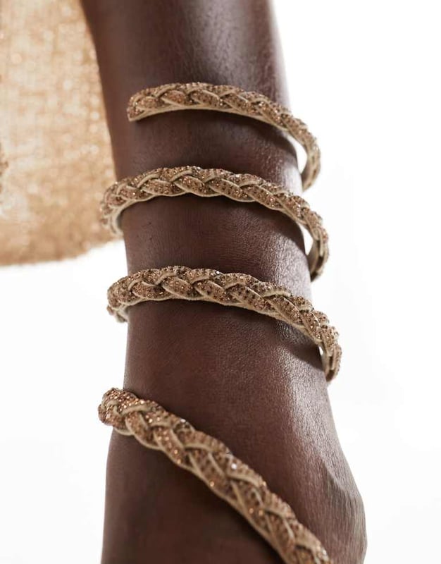 Shoes by SIMMI Shoes Sun's out, toes out Wrap-around design Diamante embellishment Open toe Rope midsole High wedge heelSold By: Asos