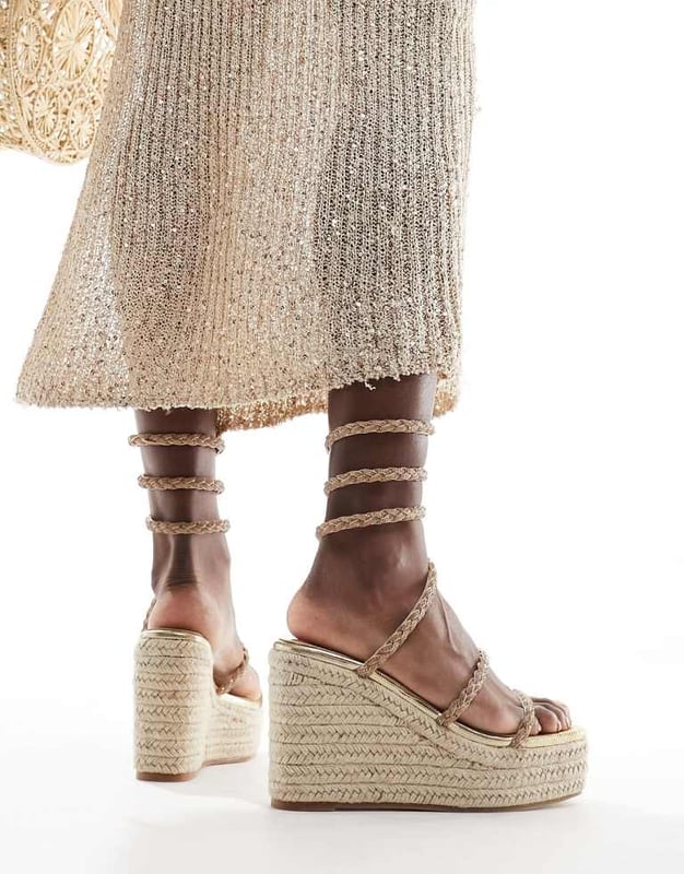 Shoes by SIMMI Shoes Sun's out, toes out Wrap-around design Diamante embellishment Open toe Rope midsole High wedge heelSold By: Asos