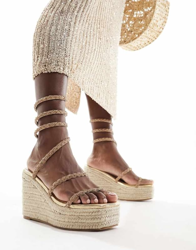 Shoes by SIMMI Shoes Sun's out, toes out Wrap-around design Diamante embellishment Open toe Rope midsole High wedge heelSold By: Asos