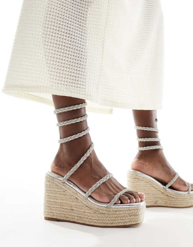 Shoes by SIMMI Shoes Sun's out, toes out Wrap-around design Diamante embellishment Open toe Rope midsole High wedge heelSold By: Asos