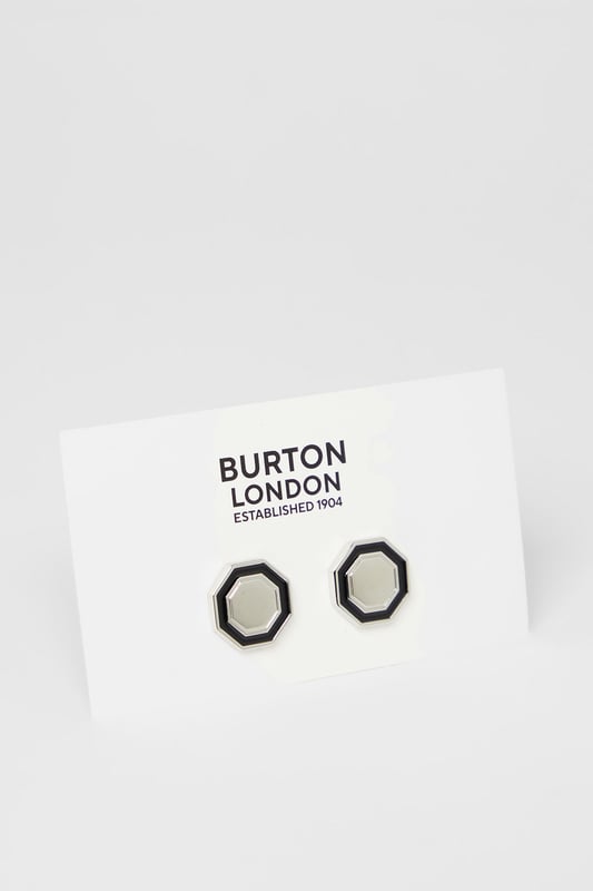 Distinctive hexagonal design for a contemporary twist on classic cufflinks
        Two-tone metal finish creates a sophisticated contrast
        Secure fastening mechanism ensures they stay in place throughout the day
        Polished metal surface reflects light for subtle sophistication
        Versatile size suitable for both standard and French cuff shirts
    
    These striking hexagon cufflinks from Burton offer the perfect finishing touch to your formal attire. The bold geometric design presents a modern interpretation of traditional cufflinks whilst maintaining a timeless appeal. Pair with a crisp white shirt for important meetings or job interviews to convey attention to detail. For evening events, these cufflinks complement a classic dinner suit brilliantly, adding just the right amount of personality without overwhelming your ensemble. The contrasting silver and black elements make them remarkably versatile, working seamlessly with various shirt colours and suit styles. Whether you're attending a wedding, important business meeting or simply want to sharpen up your office attire, these cufflinks provide that refined touch that demonstrates sartorial confidence. A subtle yet impactful way to express your style whilst maintaining professional decorum.