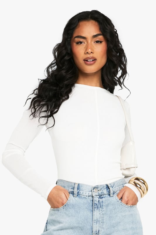 Textured mesh fabric with distinctive seam detailing for added visual interest
        Long sleeves with a close fit for a sleek silhouette
        Versatile round neckline that works for multiple styling options
        Figure-hugging design that contours to your shape
        Subtle stretch in the fabric allows for comfortable all-day wear
    
    This textured mesh top combines contemporary style with everyday comfort. The distinctive seam detailing creates visual interest while the form-fitting silhouette flatters your figure beautifully. Style it as seen with your favourite denim jeans for casual coffee dates or weekend shopping trips. For evening socials, tuck it into a leather skirt and add statement jewellery to transform your look. The versatile design makes it perfect for layering under dungarees or pairing with printed trousers for a more adventurous ensemble. The lightweight mesh construction ensures breathability whilst maintaining shape throughout the day, making this Boohoo piece an essential addition to your wardrobe that transitions effortlessly from day to night.