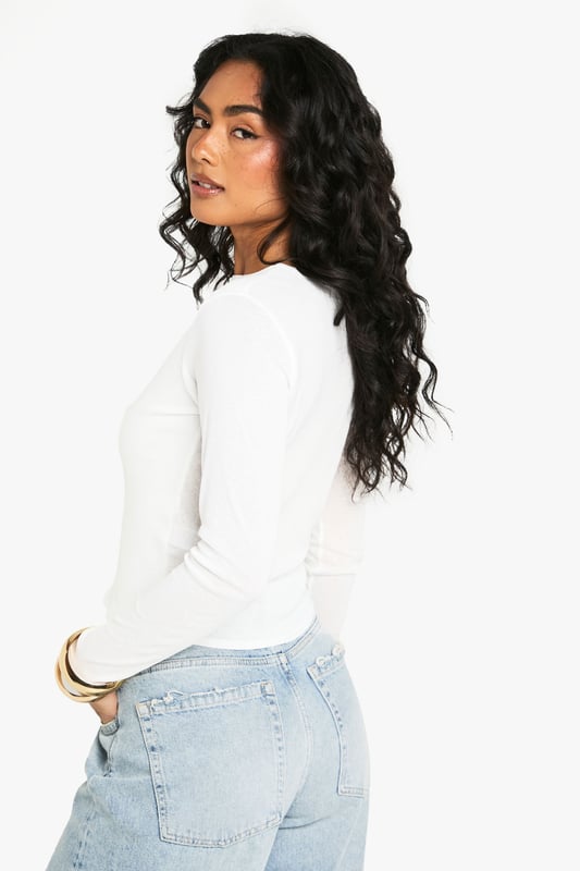 Textured mesh fabric with distinctive seam detailing for added visual interest
        Long sleeves with a close fit for a sleek silhouette
        Versatile round neckline that works for multiple styling options
        Figure-hugging design that contours to your shape
        Subtle stretch in the fabric allows for comfortable all-day wear
    
    This textured mesh top combines contemporary style with everyday comfort. The distinctive seam detailing creates visual interest while the form-fitting silhouette flatters your figure beautifully. Style it as seen with your favourite denim jeans for casual coffee dates or weekend shopping trips. For evening socials, tuck it into a leather skirt and add statement jewellery to transform your look. The versatile design makes it perfect for layering under dungarees or pairing with printed trousers for a more adventurous ensemble. The lightweight mesh construction ensures breathability whilst maintaining shape throughout the day, making this Boohoo piece an essential addition to your wardrobe that transitions effortlessly from day to night.