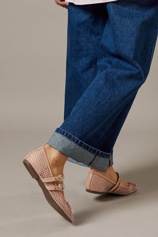 Sheer mesh upper creates a delicate, feminine aesthetic
        Double Mary Jane buckle straps for adjustable fit and distinctive style
        Ballet flat silhouette with comfortable heel height under 2cm
        Decorative studded embellishments add contemporary flair
        Textured pattern detailing for visual interest and dimension
    
    The Faith Giada Ballet Flats reimagine a classic silhouette with modern sensibility. The sheer mesh construction offers breathability whilst the double buckle straps create a secure fit with vintage-inspired charm. These versatile flats can be styled with rolled-up denim jeans for a casual daytime look, as shown by our model, or paired with floaty midi dresses for family gatherings. The subtle studded detailing along the straps adds just the right amount of interest without overwhelming your ensemble. Perfect for city explorations or weekend brunches, these flats provide all-day comfort without sacrificing style. The neutral palette ensures these will become a wardrobe staple that complements virtually any casual outfit. Ideal for those moments when you need something more refined than trainers but desire the same level of comfort.